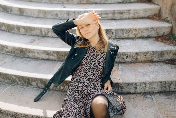 Give formalwear a tomboy fashion style twist with a one-piece dress, leather jacket, and ankle boots