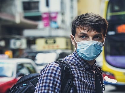 man walking wearing face mask